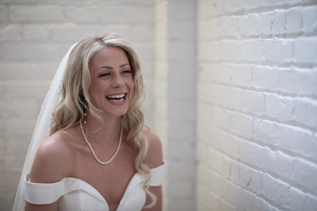 bride enjoying a nervous laugh before her ceremony at gordon green venue in cleveland