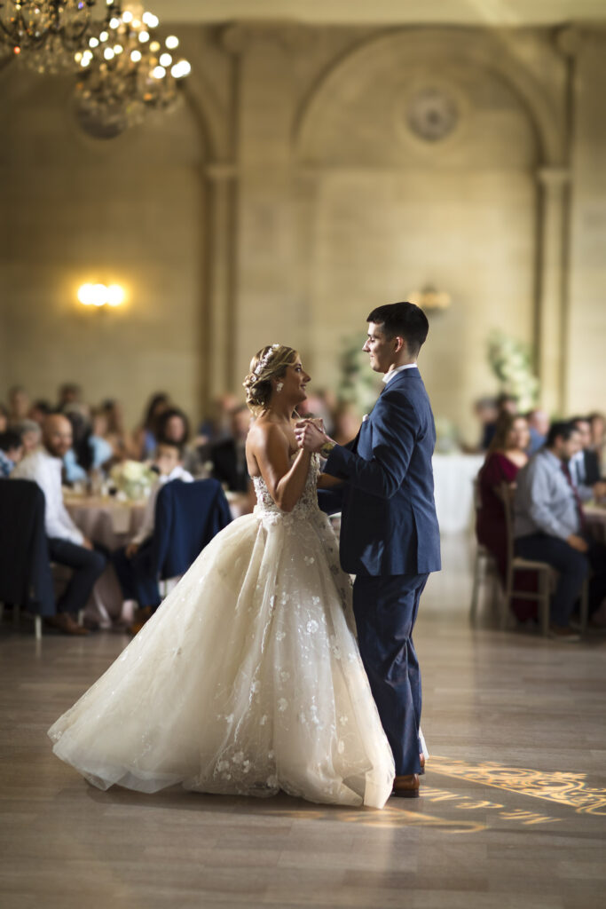 the bride and groom share a dance at the cleveland wedding venue ariel pearl center