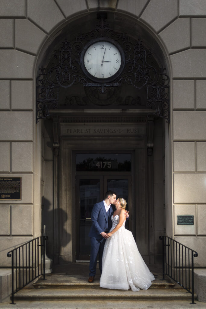 the bride and groom pause for a portrait at the cleveland wedding venue ariel pearl center